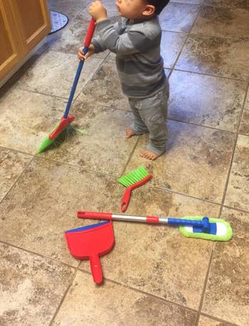 image of reviewer's child playing with the cleaning set