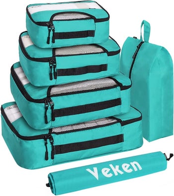 light blue packing cubes in different sizes