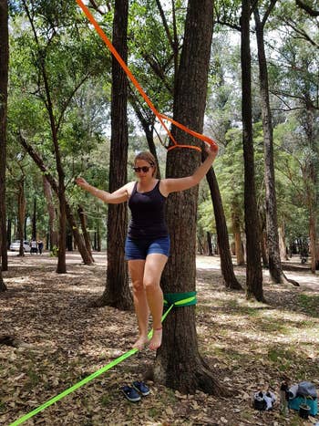 a reviewer using the slackline with a training line