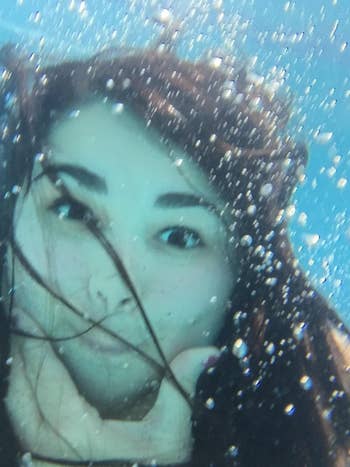 reviewer underwater selfie using the phone case