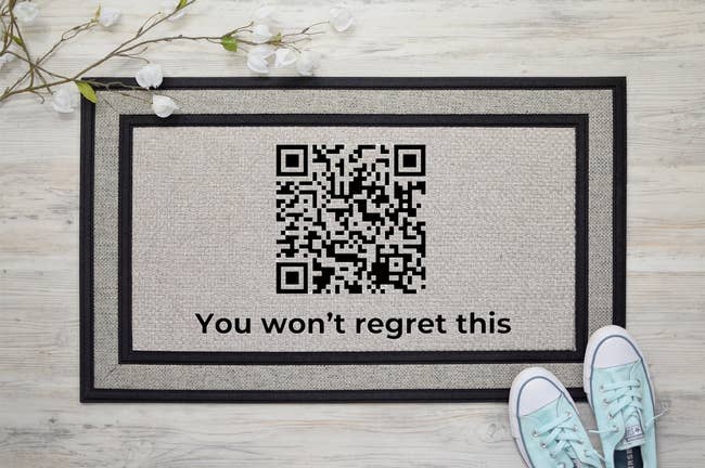 doormat with QR code that says 