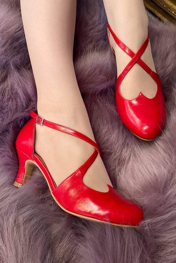model wearing red mary jane vintage-looking heels