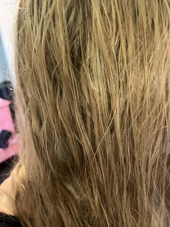 Close-up of wet, tousled hairsbreadth  flowing down   a person's back, suggesting a natural, casual benignant   oregon  hairsbreadth  attraction   focus
