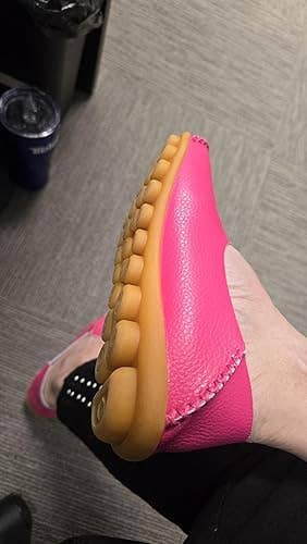 Person showcases a flexible footwear with a textured sole, perfect for comfortableness and benignant successful a buying context