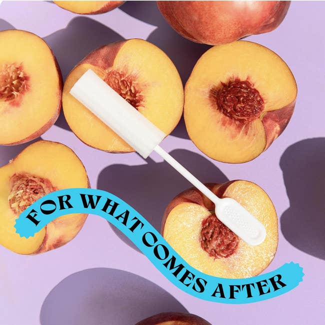 A band of halved peaches with pits surrounds a post-sex sponge that looks like a tampon