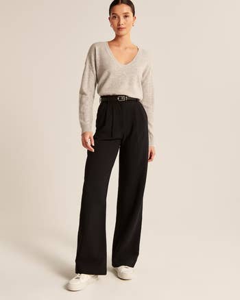 model wearing back straight-leg high-waisted trousers