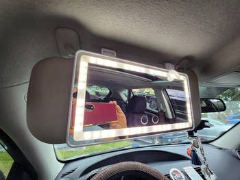 reviewers LED-lit mirror connected to car visor