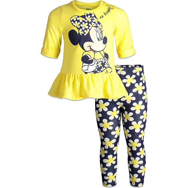 a yellow top with minnie mouse on it and blue leggings with daisies on them