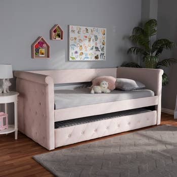 pink velvet trundle bed in little girl's room