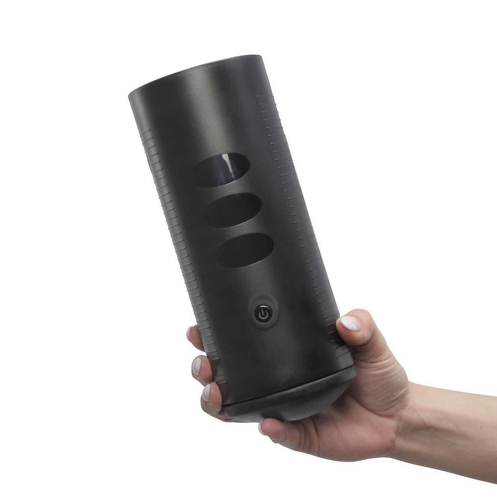 Model holding black masturbator sleeve