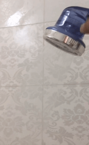 gif of reviewer showing different stream settings on shower head