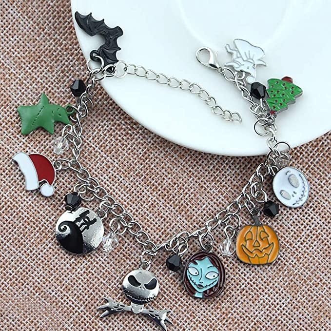 a charm bracelet with various nightmare before christmas charms around it
