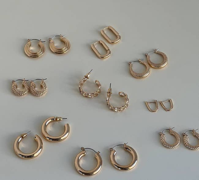 nine different pairs of gold hoops