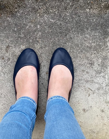 reviewer wearing the black flats