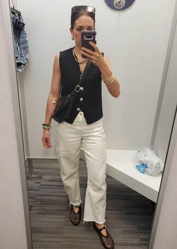 reviewer in black vest