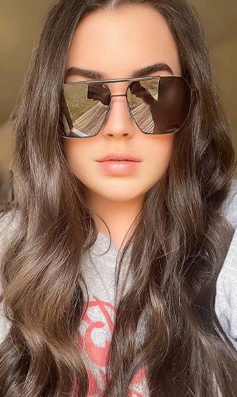 reviewer wearing sunglasses in a selfie