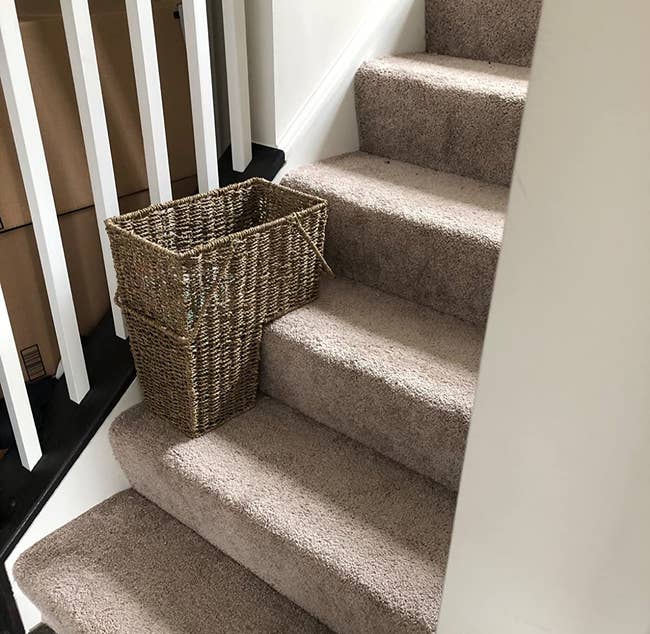 the l-shaped basket on a reviewer's stairs