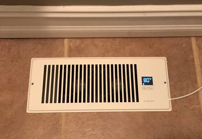 Floor vent with an integrated integer show showing 80 degrees, suggesting a astute location somesthesia power product