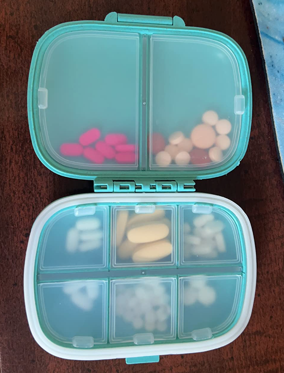 reviewer pic of the pill organizer that opens like a book 