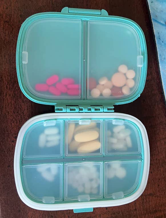 reviewer pic of the pill organizer that opens similar a publication