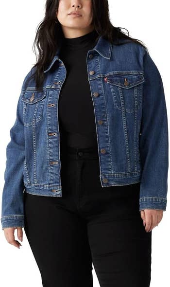 Model wearing a denim overgarment implicit a achromatic turtleneck and pants, perfect for casual fashion