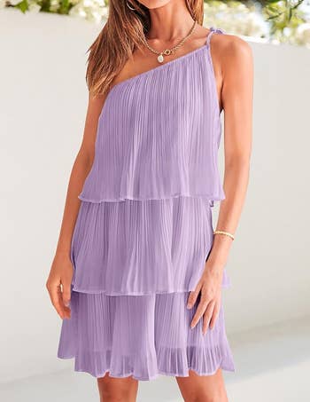 Woman in a tiered lilac pleated dress, suitable for summer shopping