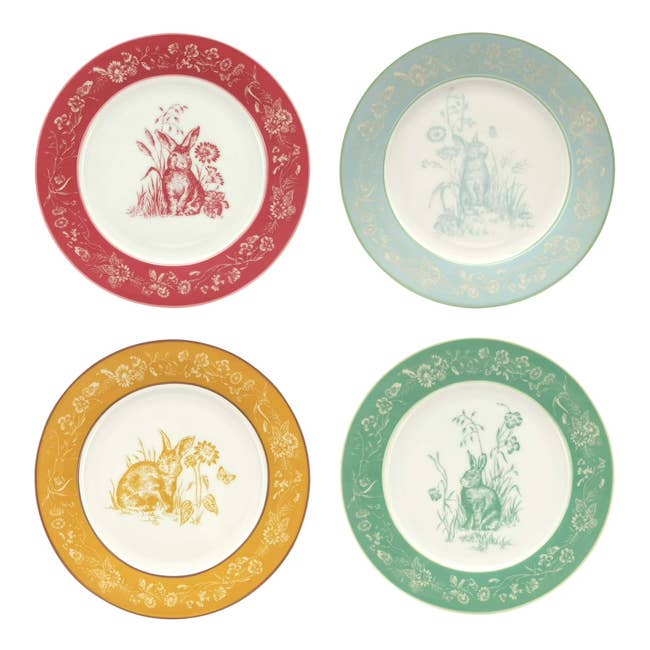 Four decorative plates featuring vintage-style rabbit illustrations connected  floral rims