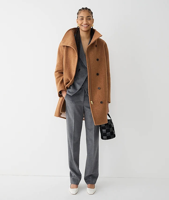 A model wearing the coat in camel brown