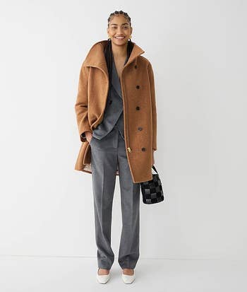 A model wearing the coat in camel brown