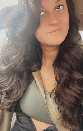 Reviewer with long hair in wide curls 