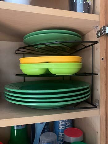 another reviewer's black organizer on a shelf holding plates