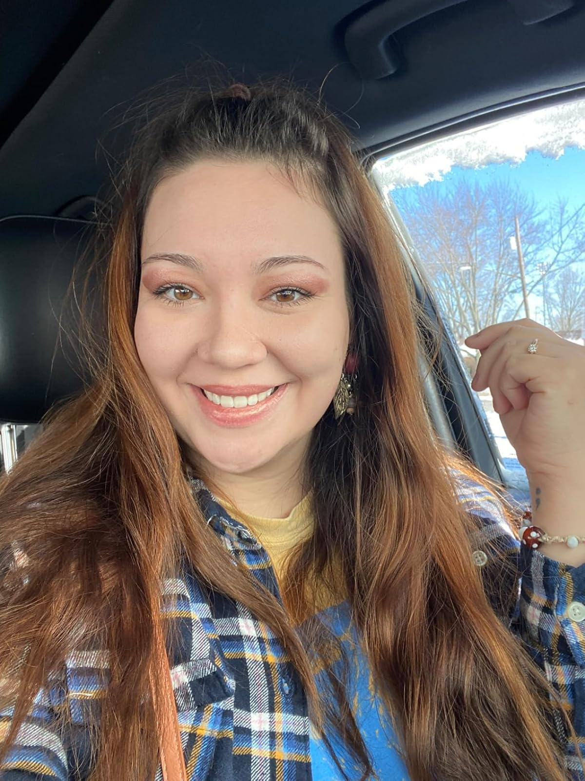 reviewer with reddish eyeshadow on