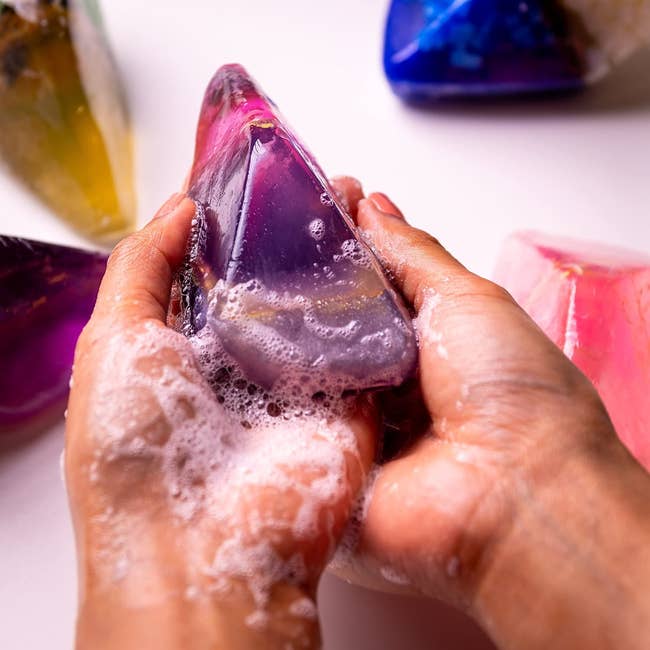 hands washing with gem shaped soap bar 