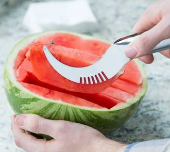 model cutting into watermelon