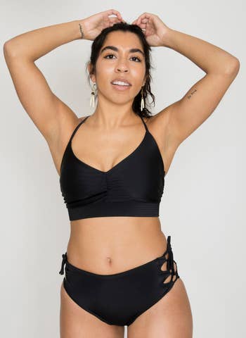 a model wearing the top in black 