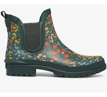 the green Rowan Wildwood boot with red, yellow, and blue flowers on it