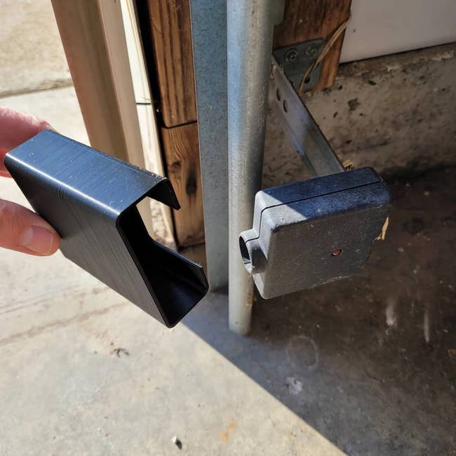 Shade held in front of garage door sensor