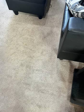 the same carpet with no visible stains on it after using the product 