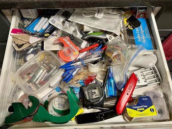 a reviewer photo of a cluttered drawers 