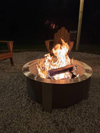 An outdoor occurrence  pit with a cozy occurrence   