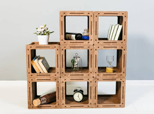 wood stained boxes arranged to look like a shelving unit