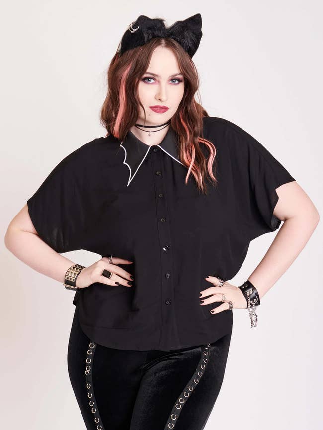 black blouse with bat wing collar