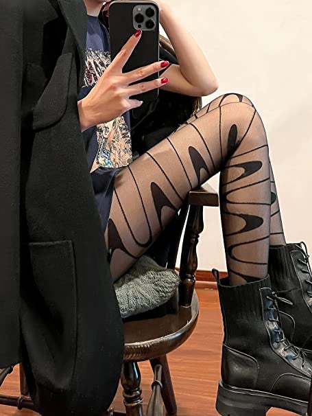 a model wearing the black wavy stocking