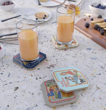 two glasses on 70s-themed coasters