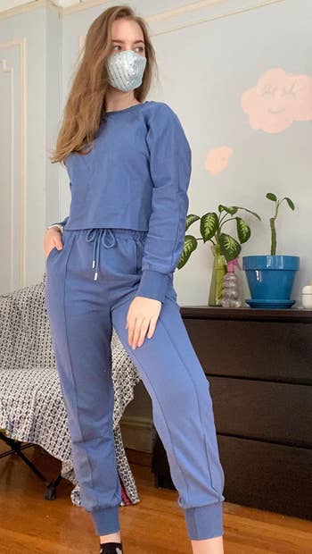 another reviewer in a matching blue sweat set