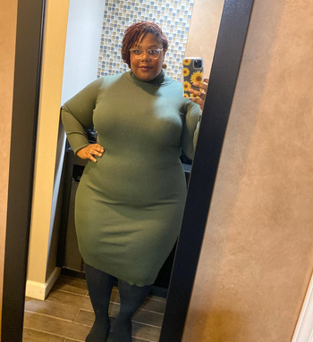 reviewer mirror selfie wearing the dress in olive green
