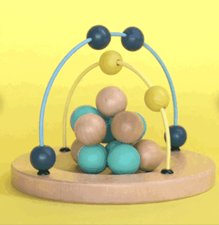 Wooden bead maze artifact  with multi-colored beads successful  question  connected  a woody  base