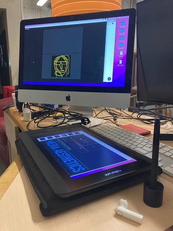 Reviewer's picture of the tablet connected to her desktop computer