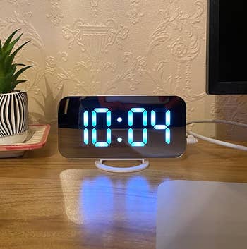 the rotating digital clock on a reviewer's desk