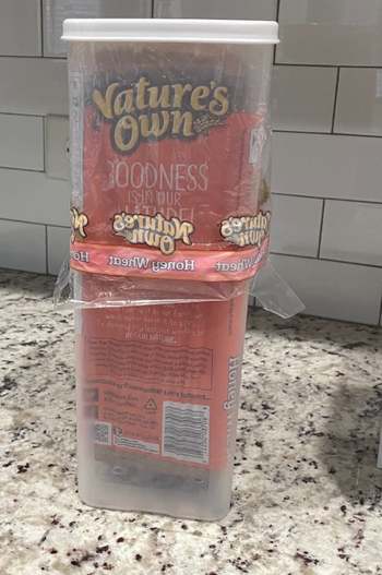 An image of the rectangular bread holder with a loaf inside